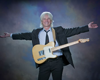 Phillip Holding Guitar with Arms Spread